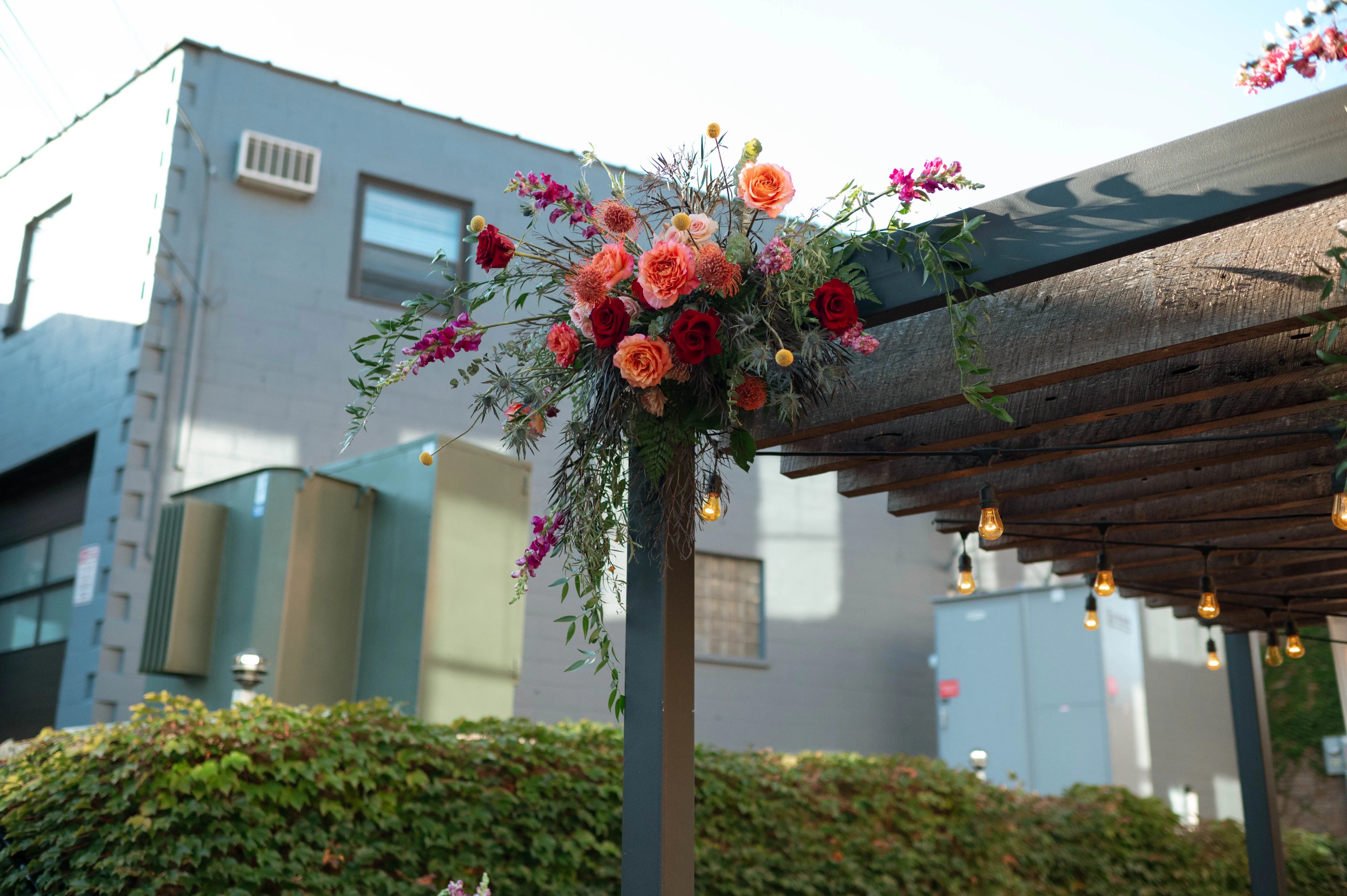 Floral installation detail on the pergola post at Hotel Crosby