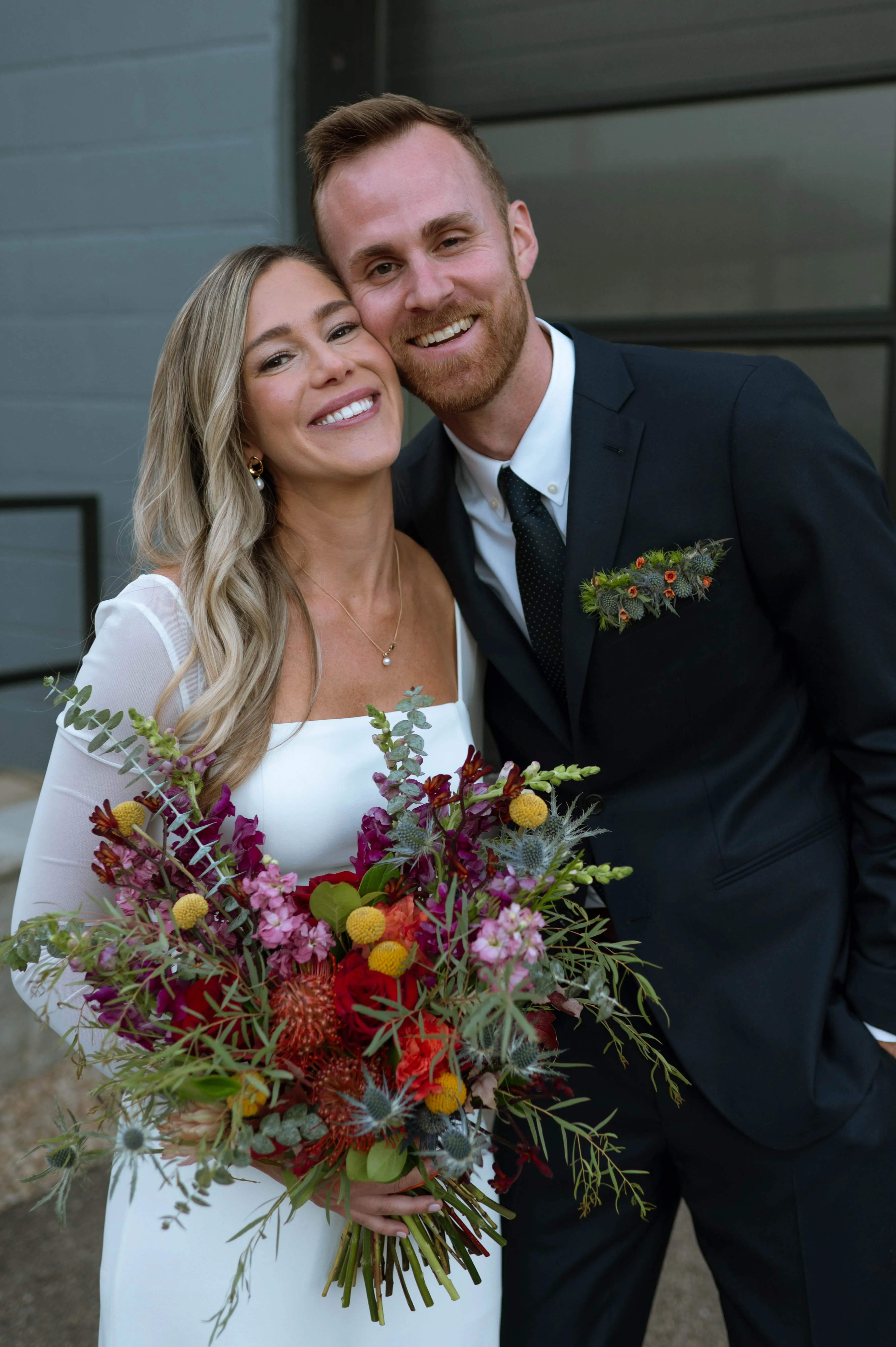 A cheek-to-cheek portrait, bouquet in frame