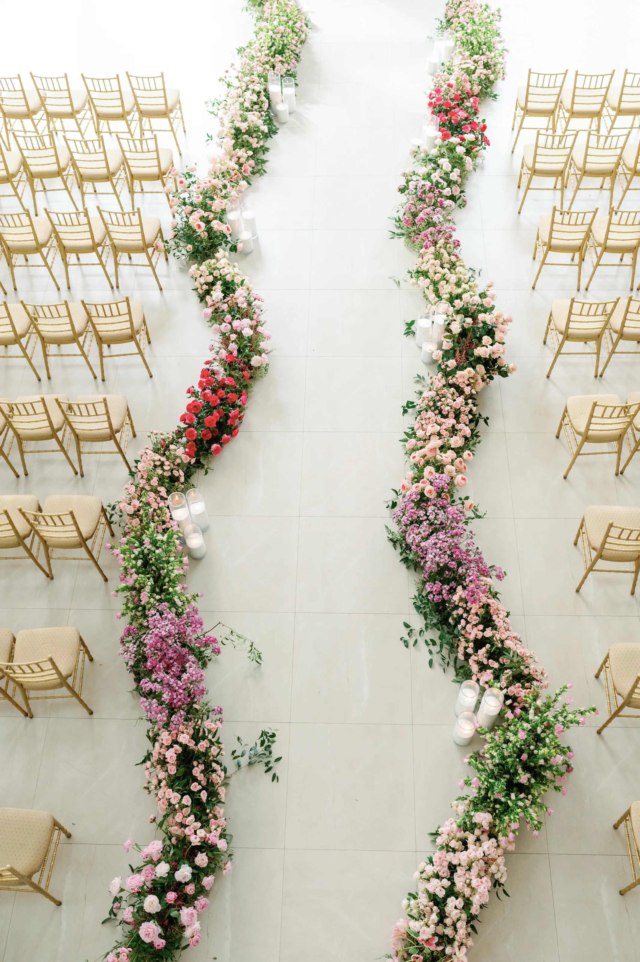 Detail of the ceremony mantel, greenery and blush roses cascading down the fireplace surround