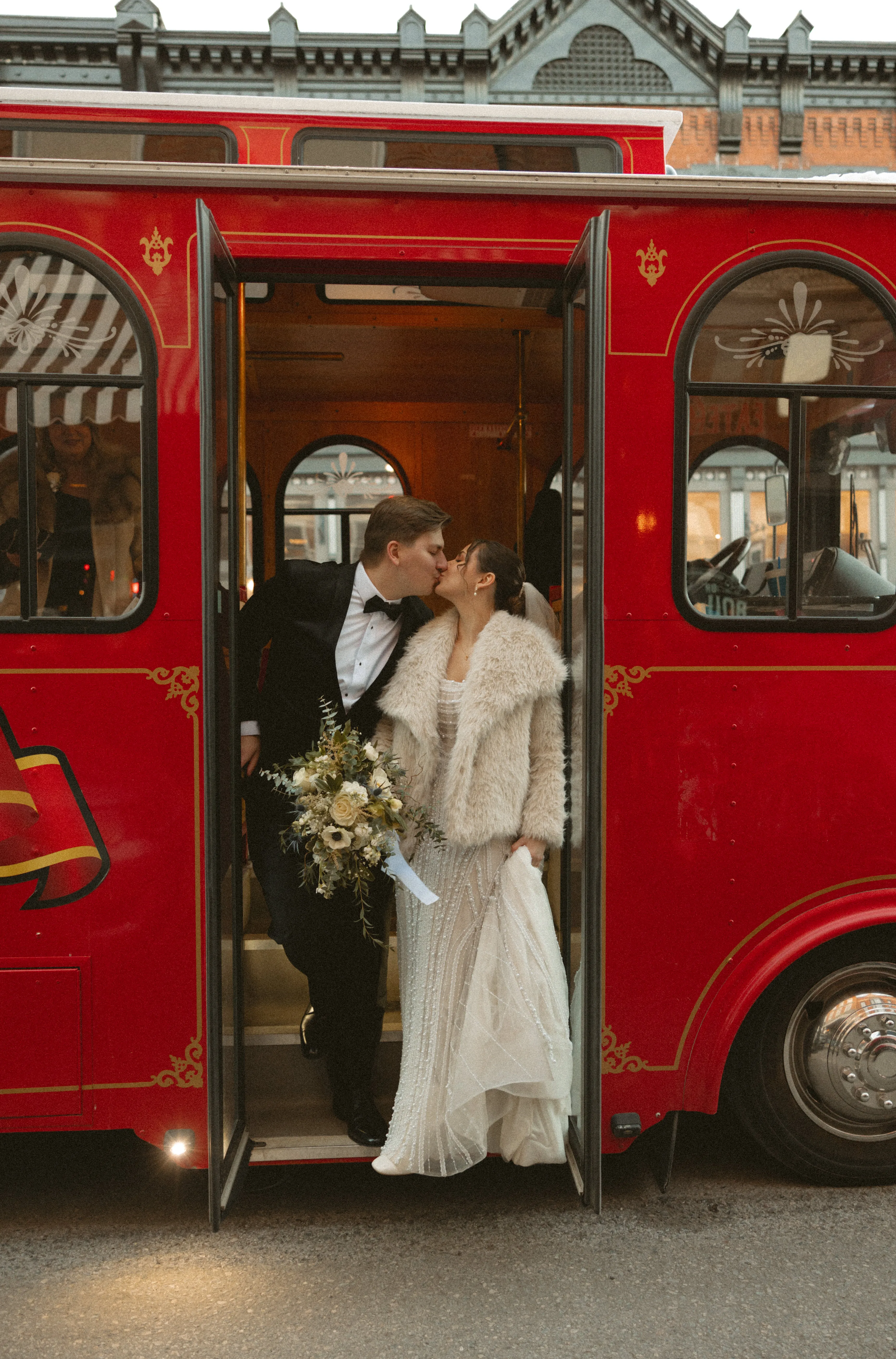 A kiss in the trolley doorway, Allie's bouquet close at hand