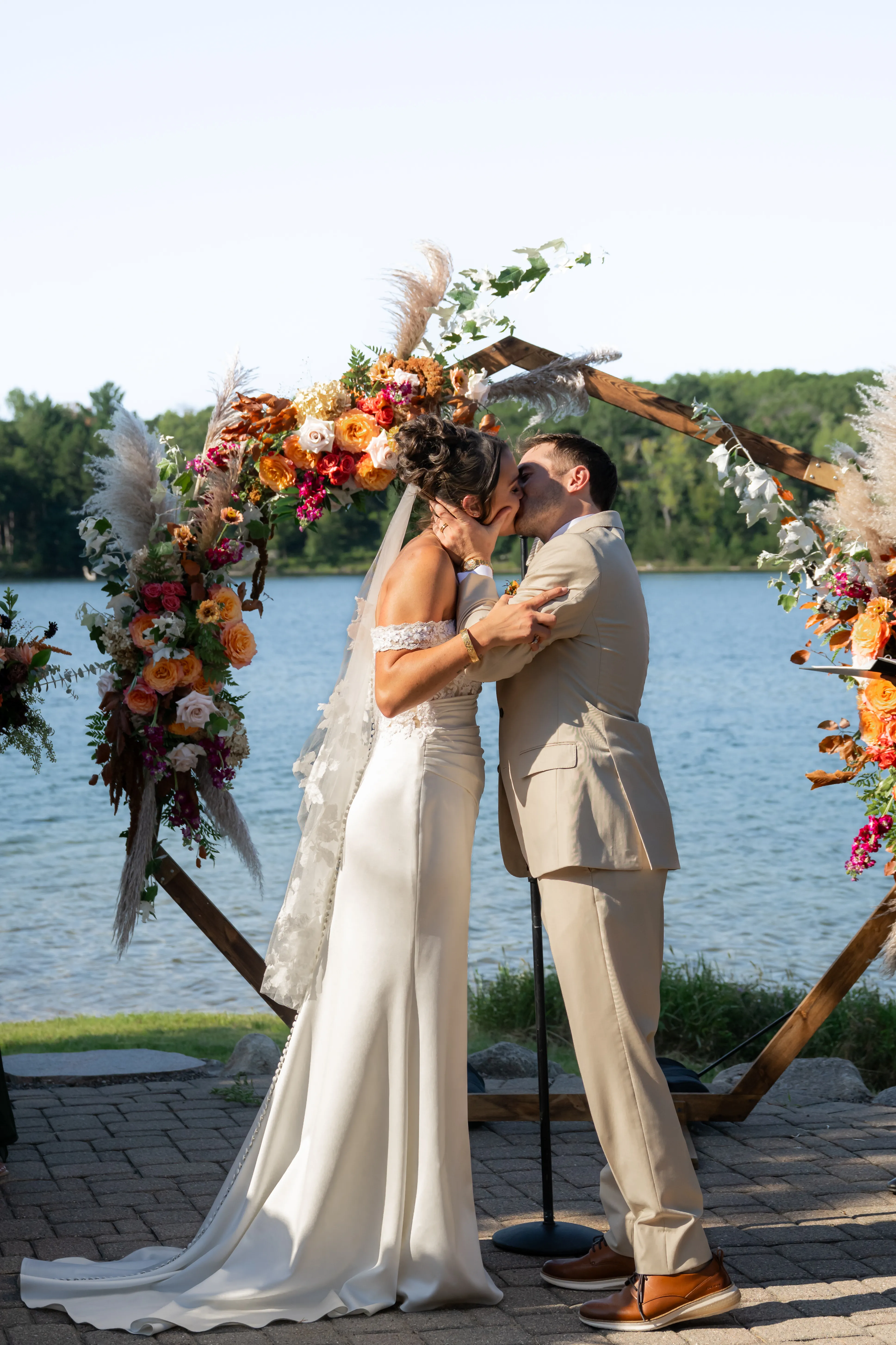 Katie and Kurt's first kiss beneath the hexagon arbor